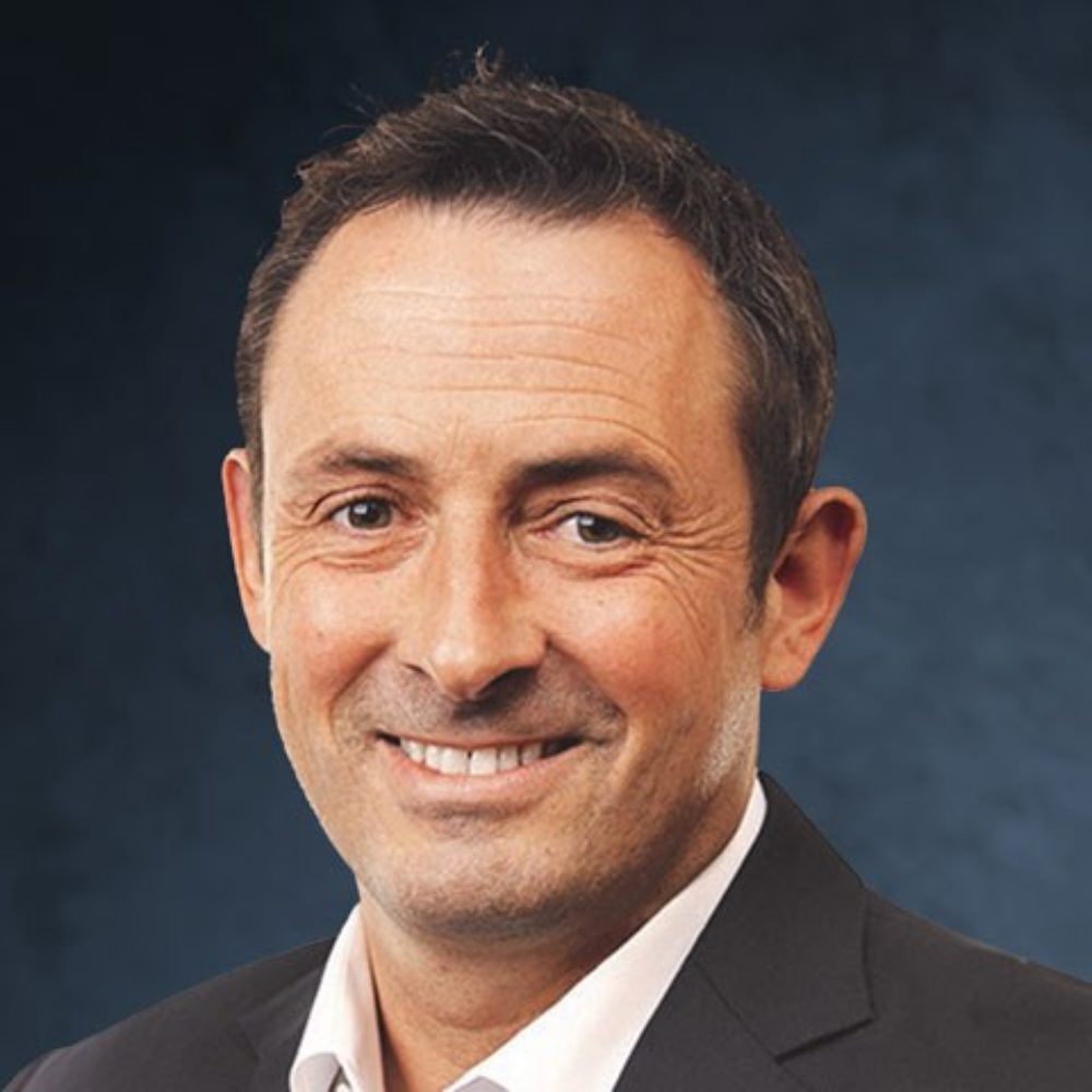 A professional headshot of Chris Kirke.